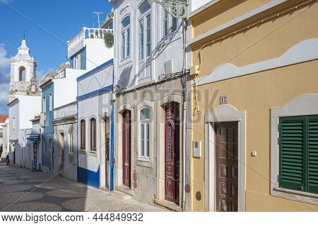 Old Town Alley Rua De Sao Goncalo In Lagos In The Algarve In Portugal. In The Background The Santo A