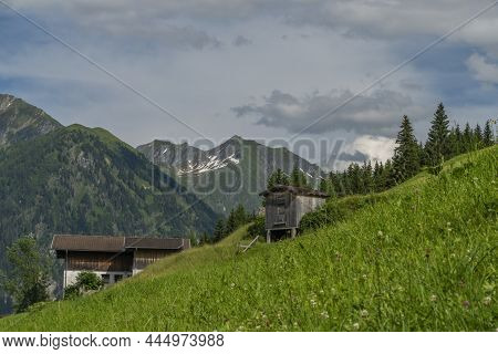 Summer Valley With Grossarler Ache Small River And Blue Cloudy Sky