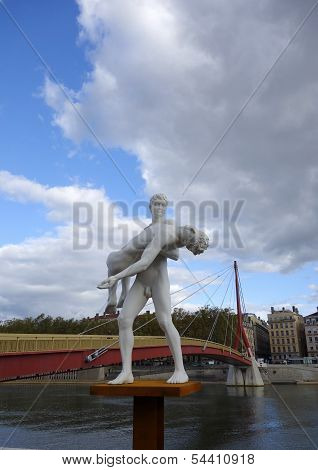 The weight of One Self sculpture in the front of  Bridge of the Palace of Justice in Lyon