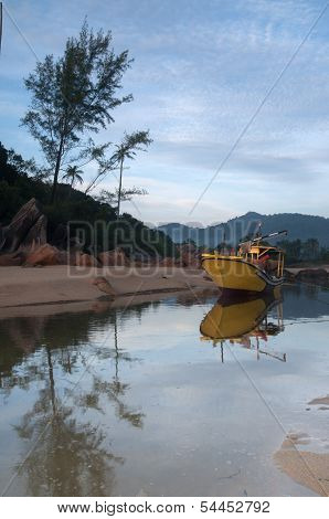 yellow boat at beach