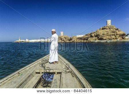 Arabic Ferry Man Transports Passenger In An Old Traditional Boat