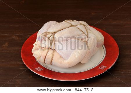 Bondage Shibari Raw Chicken On Red Boarder Plate On Dark Wood Background
