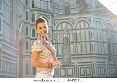 Portrait Of Happy Young Woman In Front Of Cattedrale Di Santa Ma