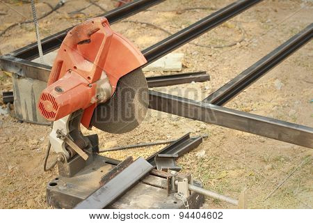 Mechanic Cutting A Steel At The Park