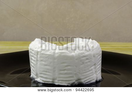 Fresh Cheese Over Black Dish And Wood.