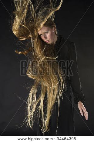 Blond Woman with Wind Blowing Through Long Hair