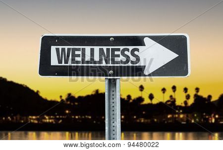 Wellness direction sign with sunset background