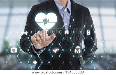 business salesman agent hand pressing button protection health concept travel insurance.