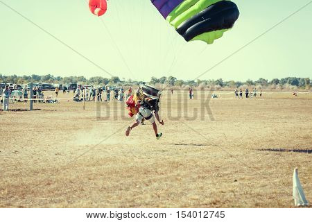 Parachute jumper on a wing parachute execute a controlled descent by parachute