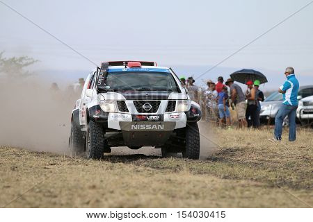 Speeding White And Black Nissan Navara Rally Car Front View