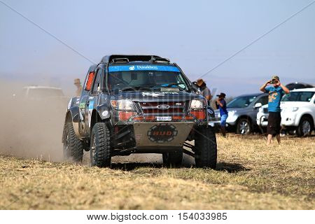 Speeding Black Ford Ranger Rally Car Front View
