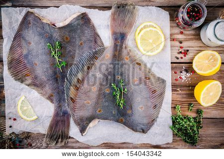 Raw Flounder Fish, Flatfish On Wooden Table