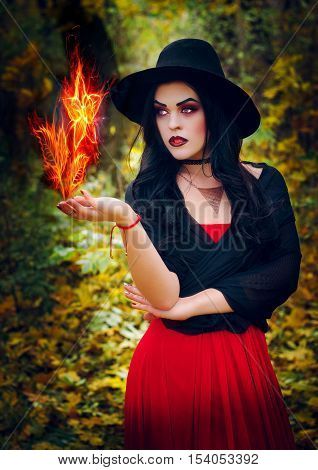 Beautiful girl in the image of the witch
