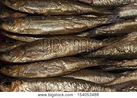 Seafood top view of group smoked fish in a supermarke close-up
