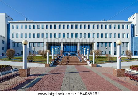 GOMEL BELARUS - APRIL 3 2016: Unknown woman goes down on stairs from Republican Scientific and Practical Center of Radiation Medicine and Human Ecology Gomel Belarus