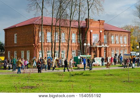 SENNO BELARUS - OCTOBER 8 2016: Local History Museum Senno Vitebsk region Belarus. Unidentified people walk outdoors during event Dozhinki-2016