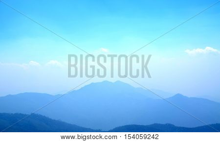 Light blue sky and mountain for background