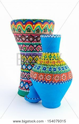 Two pieces of colorful painted potteries an Egyptian drinking jar (arabic: Kolla) and a goblet drum (also chalice drum tarabuka darbuka debuka)