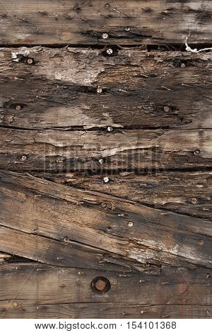 Close up weathered wood plank background with nails