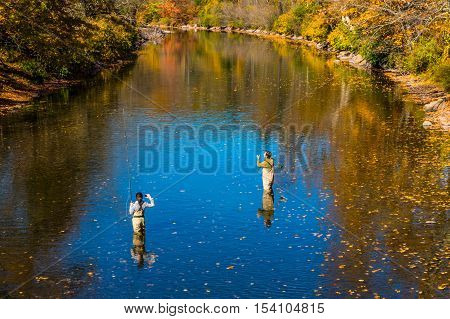 Livingston Manor NY USA - October 15 2016. Fly fishing lesson on Willowemoc Creek- October 15 2016. Fly fishing lesson on Willowemoc Creek