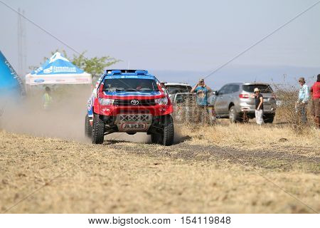 Speeding Red And Blue Toyota Hilux Twin Cab Rally Car Front View