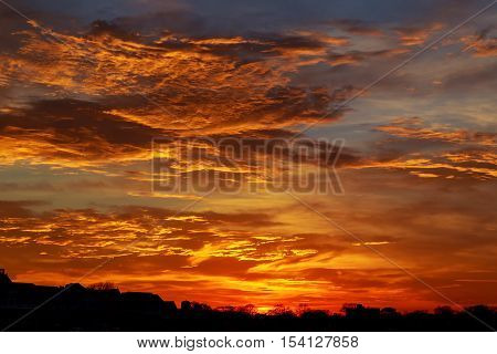 Red, Cloudy Sky At Sunset