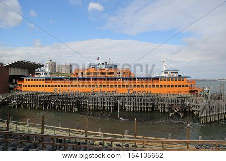 NEW YORK - OCTOBER 25, 2016: Staten Island Ferry docked at St. George Ferry Terminal on Staten Island. Every day, over 65,000 people ride the Staten Island Ferry