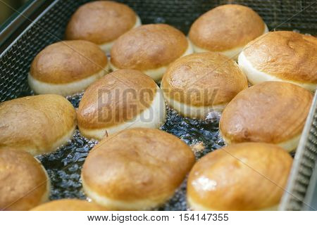 Preparation Of Donuts. Roasting In Boiling Oil
