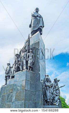 KHARKOV UKRAINE - MAY 20 2016: The monument to Taras Shevchenko also named Kobzar surrounded by the sculpture group of workers farmers and freedom fighters  on May 20 in Kharkov.