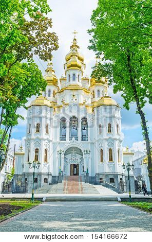 The Church of the Holy Myrrh-Bearers through the shady trees in Victory Square Kharkov Ukraine.