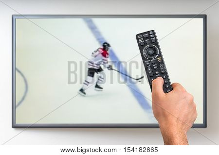 Man Is Watching Hockey Match On Tv