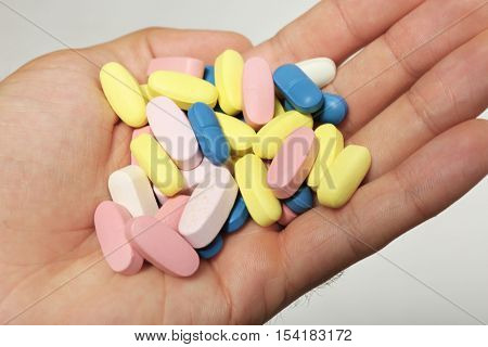 Male hand holding drugs