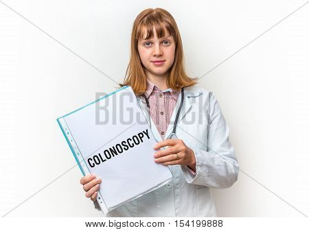 Doctor Showing Clipboard With Written Text: Colonoscopy