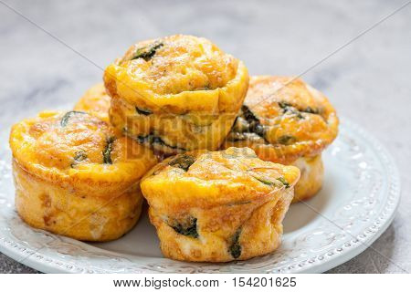 Egg muffins with spinach, bacon and cheese