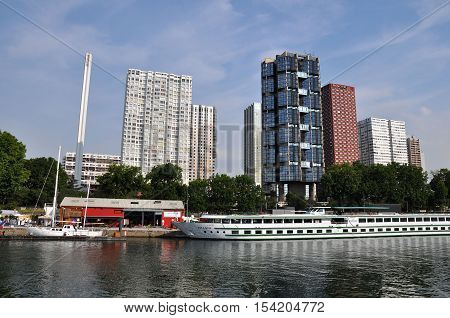 PARIS FRANCE - JULY2: The Novotel Paris Tour Eiffel hotel and boat hotel on July 2 2015 in Paris France. Novotel is a modern hotel located in Beaugrenelle area in the 15th arrondissement of Paris overlooking the Seine river.
