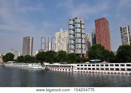 PARIS FRANCE - JULY2: The Novotel Paris Tour Eiffel hotel and boat hotel on July 2 2015 in Paris France. Novotel is a modern hotel located in Beaugrenelle area in the 15th arrondissement of Paris overlooking the Seine river.