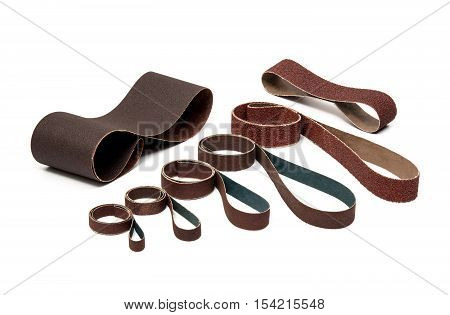 Industrial Sanding Belts Sand Papers in Rolls on White Background