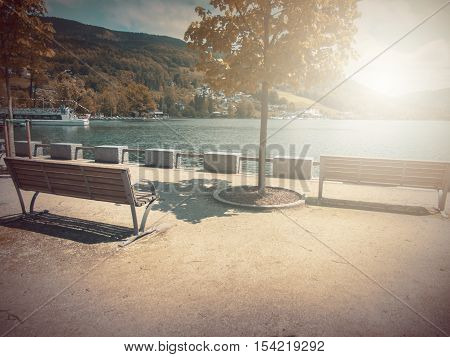 Fantasy Fable Scene Effects Applied. Blurry Bench On Side Walk By The Lake In The Europe And In The 
