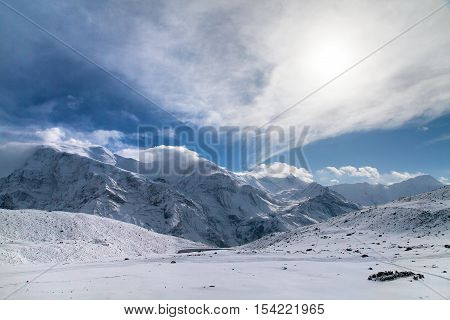 Panoramic view of Annapurna 3 III Ganggapurna and Khangsar Kang Annapurna range from Ice Lake with sun way to Thorung La pass Annapurna circuit trek Nepal
