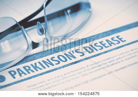 Parkinsons Disease - Printed Diagnosis with Blurred Text on Blue Background with Eyeglasses. Medical Concept. 3D Rendering.