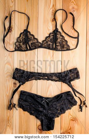 Women's Set Seductive Lingerie Close-up On The Wooden Floor