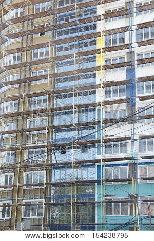 New incomplete residential building facade in scaffolding