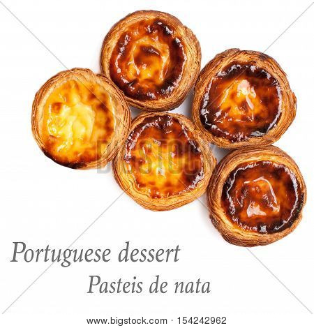 Egg Tarts isolated on white background. Heap of Typical portuguese dessert pasteis de nata close up