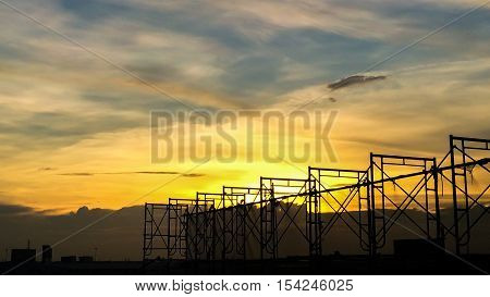 Silhouette Of Scaffolding In The Construction Site Before To Night Time Or Sunset Time. Worker Empty