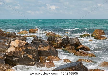 Black sea rocky shore on a cloudy day