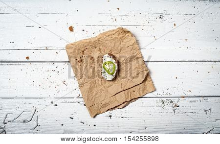 Dark bread slice with cheese and fresh salad