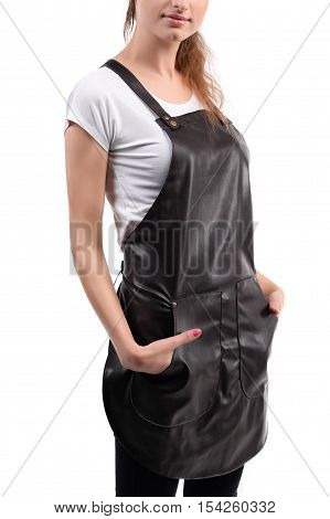 Young redhaired woman chef or waiter posing, wearing apron and white t-shirt isolated on white background