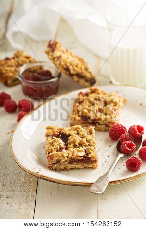 Almond oats and raspberry jam bars with crumble topping
