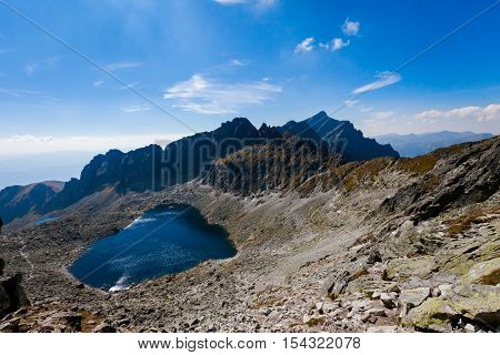 Beautiful Vysne Wahlenbergovo pleso Krivan in Furkotska dolina view from Bystre sedlo - in slovakian high Tatra mountains. Summer panorama with great weather and blue sky