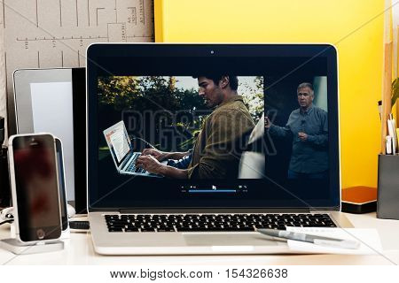 PARIS FRANCE - OCT 28 2016: Apple Computers website on new MacBook Pro Retina with OLED Touch bar in geek creative room showcasing Apple Keynote presentation of the succesor of MacBook Air